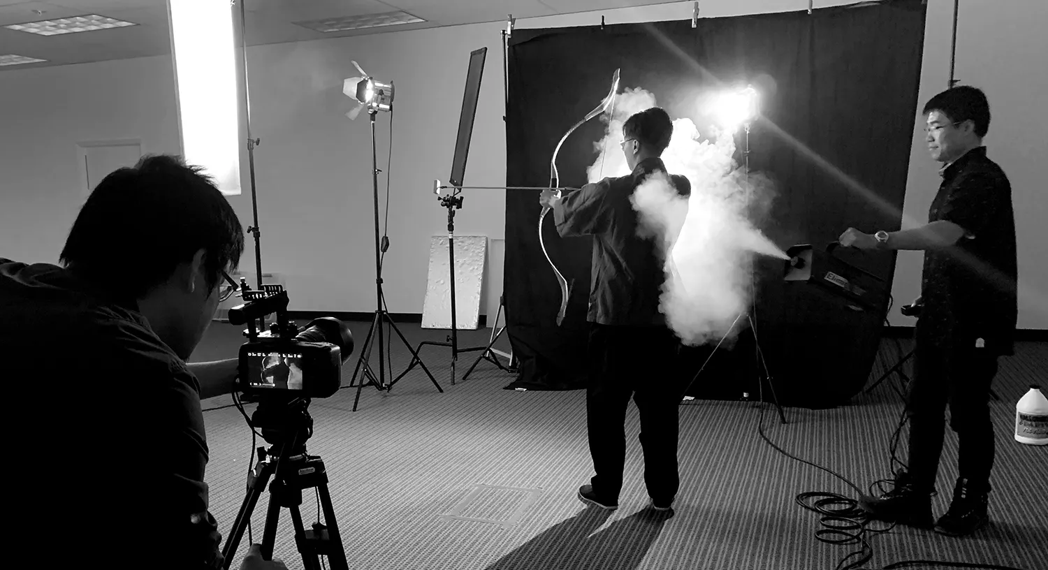 Crew filming a smoke-filled scene in the studio